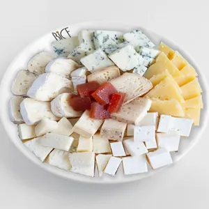 Cheese platter with curated fine cheeses and complementary accompaniments