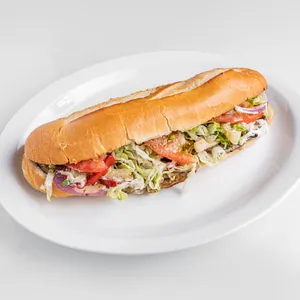 10-inch baguette sandwich with steak speck, mozzarella, provolone, onions, mushrooms, eggplant, lettuce, and tomato