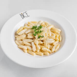 Creamy Bice mac and cheese with orecchiette, three-cheese sauce, and crisp pancetta