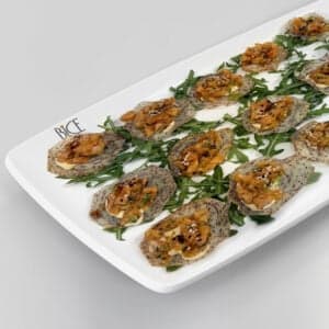 Salmon tartare with avocado, wasabi tobiko emulsion, and soy maple glaze, an Italian cuisine appetizer