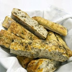 Golden focaccia drizzled with olive oil and sea salt