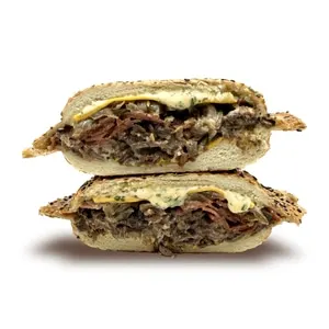Steak and pepperoni panino with cheddar, house Bombe sauce, and caramelized onions