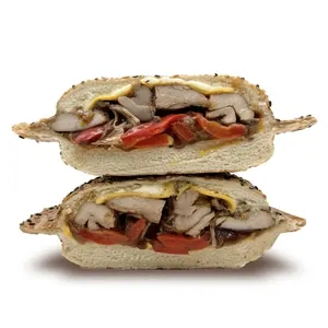 BBQ grilled chicken sandwich on a sesame panino bun with cheddar, mayo, lettuce, and tomato
