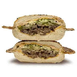 B-Mak bomb sandwich on a sesame panino bun with steak, cheddar, house sauce, pickles and lettuce
