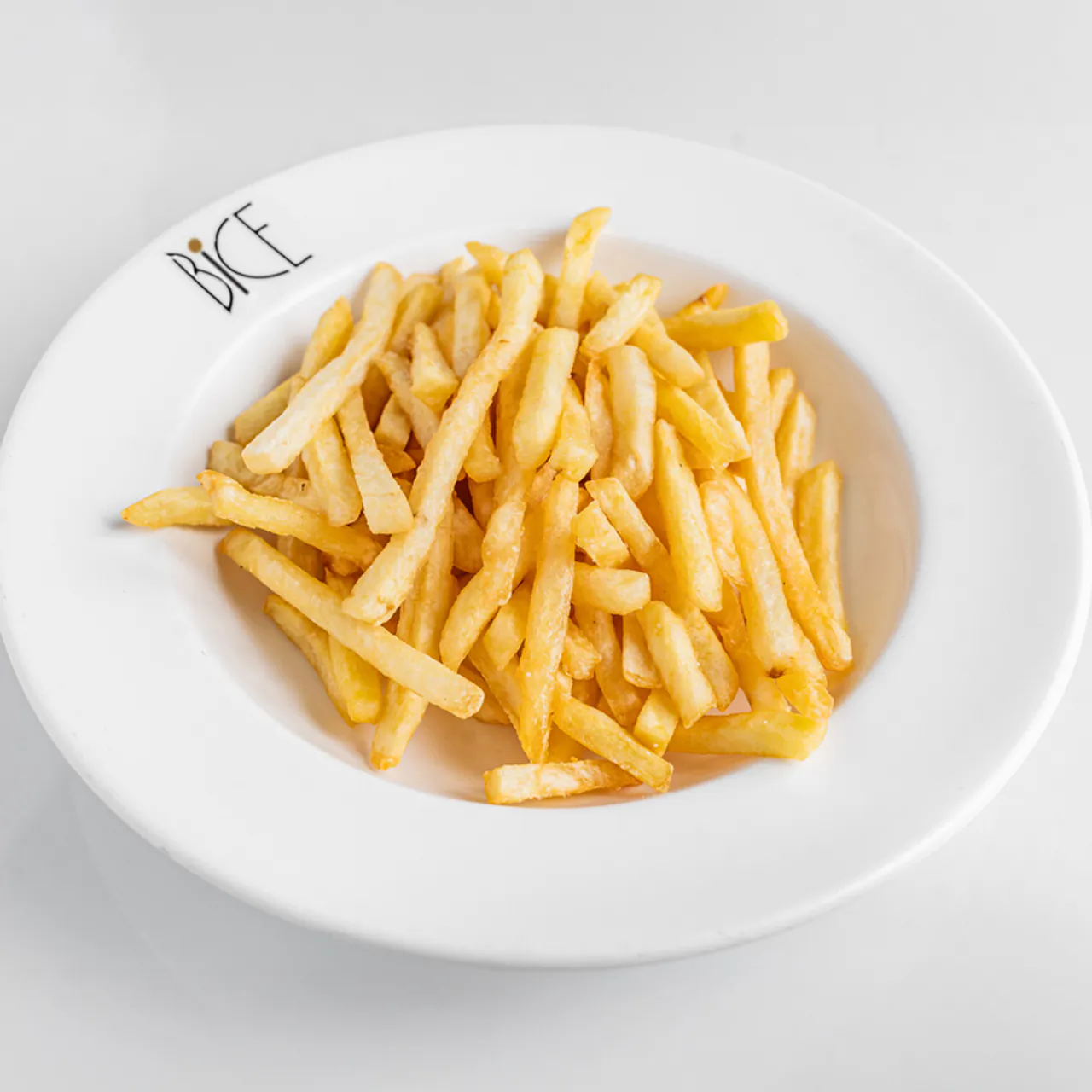 Thick-cut golden platter fries with a crispy exterior and fluffy interior, lightly salted