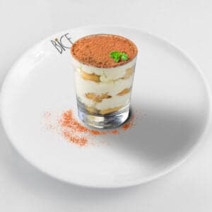 Homemade tiramisu with coffee-soaked cookies, mascarpone cream, and cocoa dusting