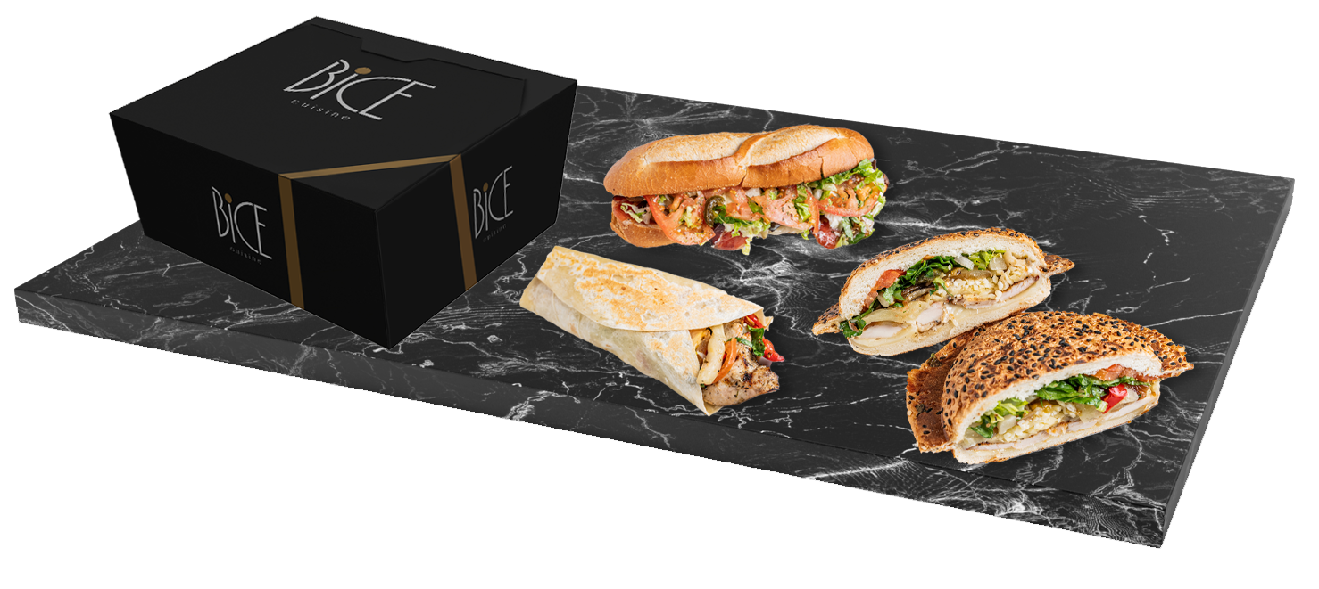 Boîte BICE et sandwichs gastronomiques présentés sur une dalle de marbre noir
